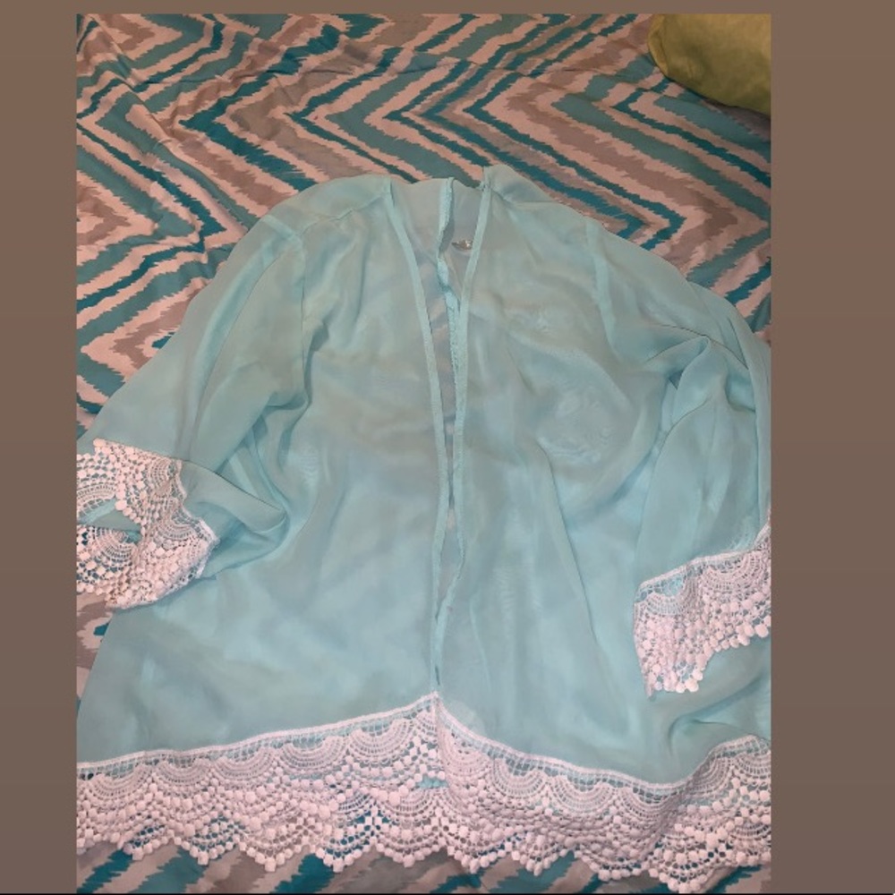 Light blue sweater.